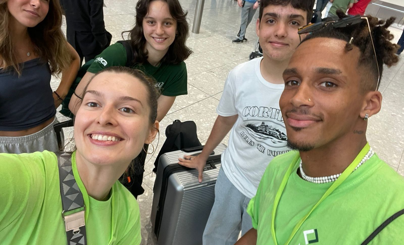 Photo of teenagers at the airport.